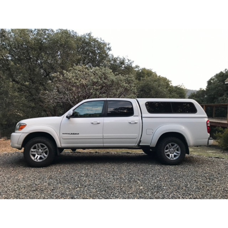 White 2006 Toyota Tundra Limited 4x4 with snug top rebel camper shell and bilstein 5100 shock upgrade.  Springs set to the second to bottom notch.  BFG all terrain K02 tires.  Size 265/70/17